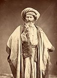 Arab man smoking pipe, late 1800s