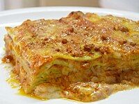 Green lasagna (made with spinach in the dough), with ragù, Parmesan, and béchamel sauce, typical of Bolognese cuisine