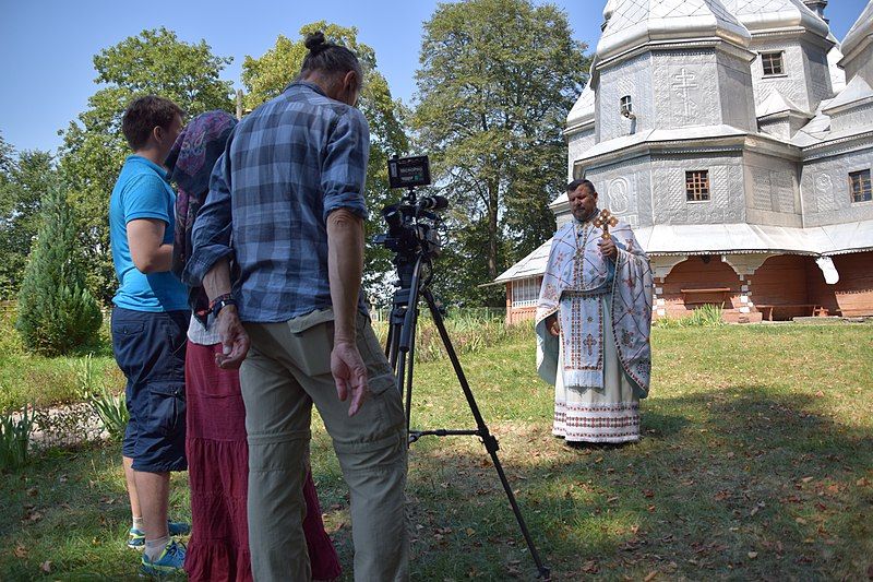 File:Interview with priest.jpg