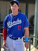 Baseball player standing in uniform