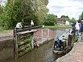 A boat leaving the bottom of the lock.