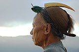 K10. A Nishi tribesman from Arunachal Pradesh wearing traditional headdress with hornbill beak. (FP)