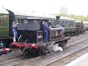 London, Brighton and South Coast Railway locomotive. Note the three pipes, one for vacuum brake, one for air brake and one for steam heat