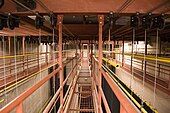 Grid-less fly tower with catwalks. Battens (yellow), under-hung blocks and lift lines are visible.