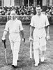 Lindsay Hassett (left) and Stan Sismey (right) walk out to bat for the Australian Services XI, against England, in the Victory Test series of 1945.