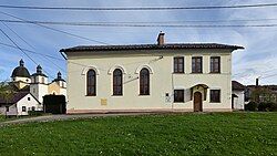 Former synagogue, now a library, and the Church of the Finding of the Holy Cross to the left