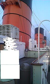 The historic Queen Mary Cruise ship/hotel is located in Long Beach, CA. Note how big the smokestacks are compared to a human.