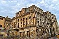 A view of the facade of one of the remaining houses from Qatif Castle, highlighting the architectural decorations alongside the neglect that has contributed to its deterioration.