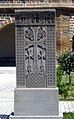 A khachkar behind the cathedral in Echmiadzin, Armenia. Place of origin is unknown.