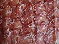 Slices of Coppa Spécialité Corse (Corsica): a balanced quantity of white fat is important for flavour and tenderness.