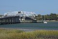 The bridge is shown in the open position to allow a sailboat to pass.