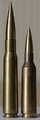 .50 BMG cartridge on the left and a .416 cartridge on the right.