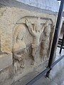 Crucifixion scene, sculpted in low relief on west end of base of chest tomb of Sir William de Tracy (d.1322), cleric, incumbent of Mortehoe; South transept.