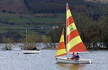 sailboat with colorful sails and crew&skipper