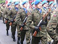 Soldiers of the Polish Army 7th Coastal Defense Brigade, wearing blue ascots striped with the flag of Poland