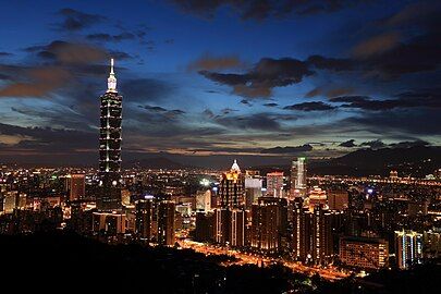 Taipei skyline viewed from Xiangshan, including Taipei 101, illuminated at dusk (2015)