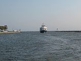 The uploader says this shot of the Davis Park Ferry is at Davis Park, New York, but I don't believe it. There are too many cars on the dock.