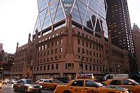 The 46-story Hearst Tower in Manhattan rises out of a cast stone facade built as the lower floors of a never-completed 1920s skyscraper.