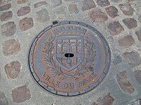 Manhole cover depicting the city's coat-of-arms