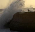 Surfer near the lighthouse on West Cliff Drive