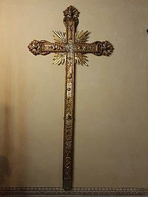 Gold-plated cross in the right chapel of the Church of St. Peter and Paul, Arese