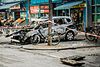 A burned-out car left in the aftermath of the protest against the European Central Bank.