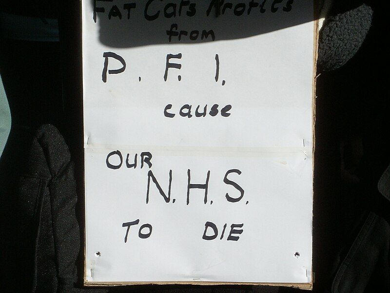 File:PFI Protest placard.JPG