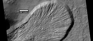 Landslide in a crater, as seen by HiRISE under HiWish program. Image from Iapygia quadrangle.