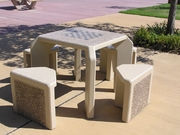 Outdoors table with a chessboard built into its top