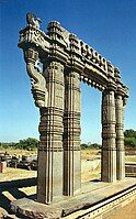 Kakatiya Kala Thoranam (Warangal Gate) built by the Kakatiya dynasty in ruins; one of the many temple complexes destroyed by the Delhi Sultanate.[37]