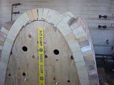 Catenary arch kiln under construction over temporary form