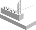 Groups of holes are drilled across the line of fracture to the tool depth of the casting.