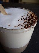 A cappuccino garnished with cocoa powder