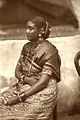 Woman in Tamil sari; in this style, the loose end is wrapped around the waist