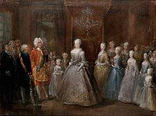 A throne room with a middle-aged lady in a silver dress standing in the middle, facin a man in a gilded red coat. Between them is a little girl in a light blue dress and a boy. Behind the lady stand five young girls, descending in height towards the edge of the canvas. Many courtiers are standing in the background.