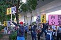 Pro-Beijing protesters outside court, with placards labeling Agnes Chow as harming Hong Kong and Ivan Lam as a traitor.