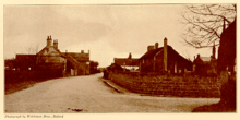 A black and white picture with a yellow tinge of the village of Scrooby taken in the fall.