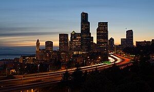 Interstate 5 curving through Downtown Seattle's skyline.