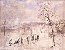 group of people on the ice of a pond