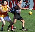 Japan Samurai captain Michito Sakaki being tackled by a Vietnamese opponent in 2006