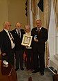 Eoghan Ganly, President of the Maritime Institute of Ireland (wearing chain of office) at Medal presentation to the grandchildren of Timoteo McCarthy, an Argentine national who served on a number of Irish ships in the war.