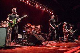 Breaking Benjamin performing in 2015. From left to right, Keith Wallen, Shaun Foist, Benjamin Burnley, Aaron Bruch, and Jasen Rauch.