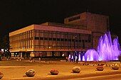 The theatre and fountain at night