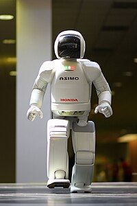 Photo of the Honda developed robot ASIMO walking toward the camera