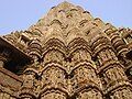 Indian sculptural treatments from Khajuraho temple telling religious stories on the surface of the temple)