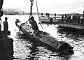 Image 10A Japanese Ko-hyoteki-class midget submarine, believed to be Midget No. 14, is raised from Sydney Harbour (from History of the Royal Australian Navy)