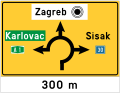 D03-2 Directional indicator for an intersection of circular shape (or an roundabout)