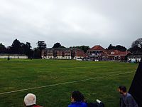 A colour photo of a cricket ground