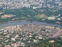 Aerial view of Nandanam, seen here to the north of the Adyar River and Kotturpuram to the south.