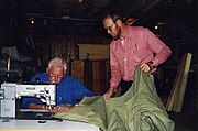 The Dutch sailmaker Henk de Boer at work, assisted by his "Schieman"